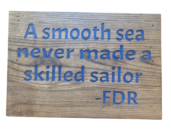 “A Smooth Sea Never Made a Skilled Sailor” Wooden Quote Sign